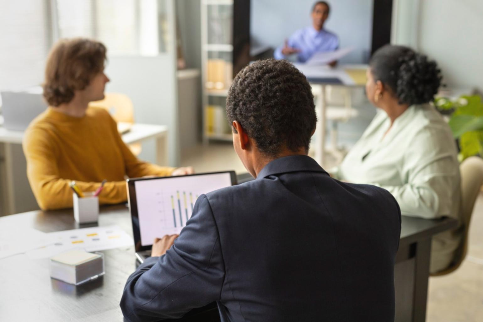 Professional consultation meeting between financial advisor and client reviewing investment documents