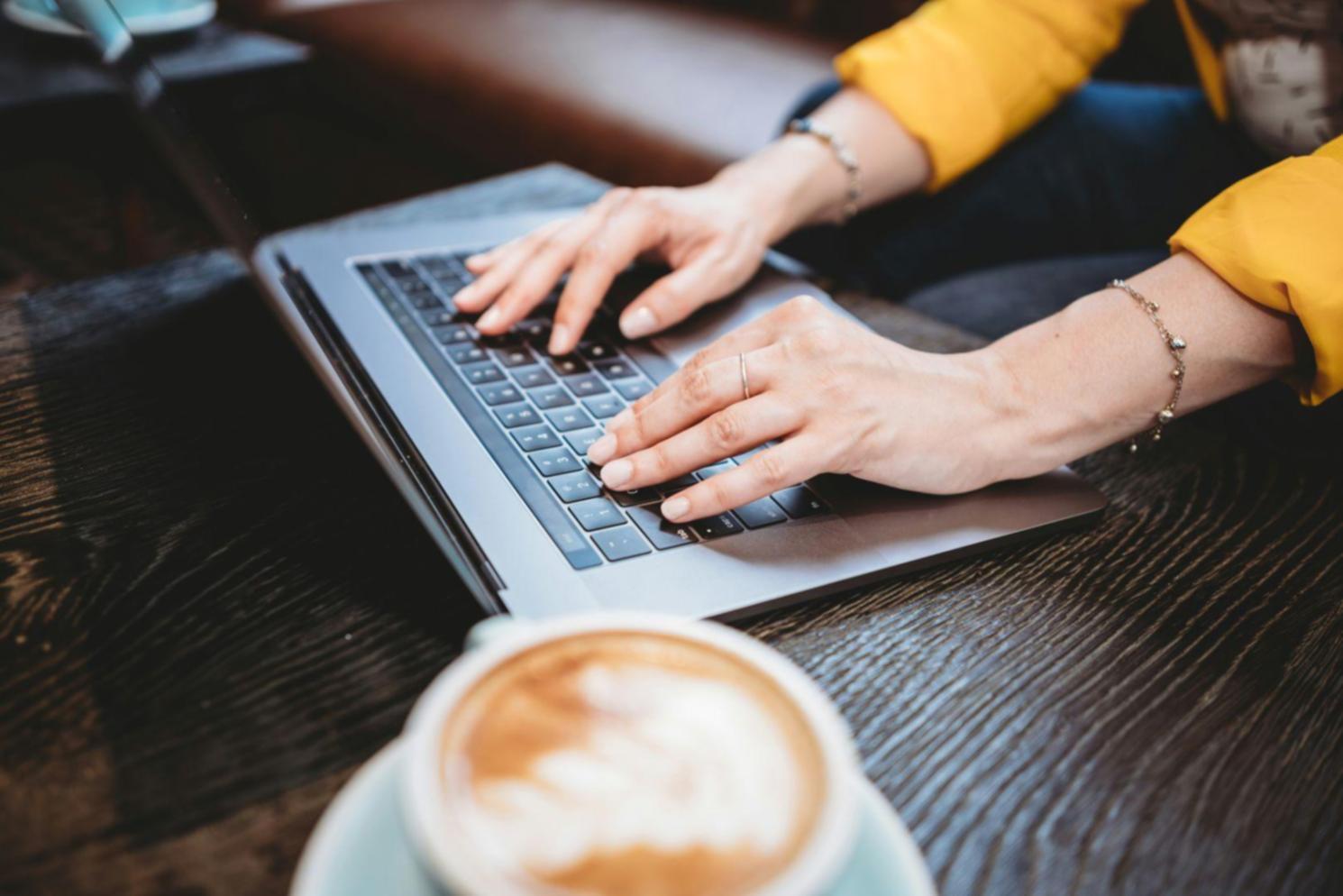 Person reviewing investment portfolio documents at home office